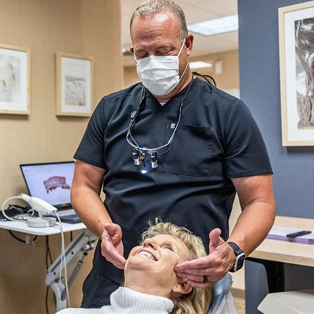 Woman being evaluated by her Greensboro sleep dentist