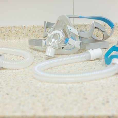 C PAP mask and tubing on a countertop