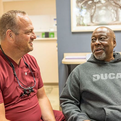 Man talking to his sleep dentist about C PAP treatment in Greensboro