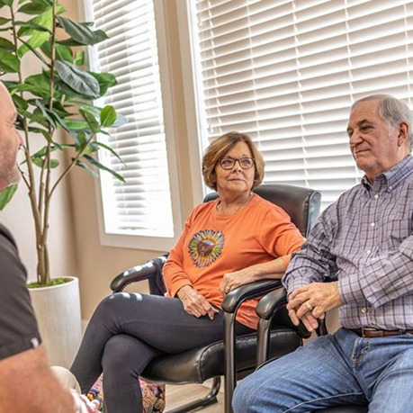 Man and woman sitting in sleep office in Greensboro