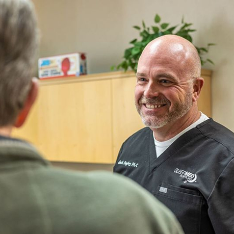 Sleep dentist smiling at a patient