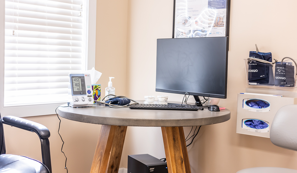 Computer on small desk in treatment room