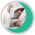 Woman waking up smiling and stretching