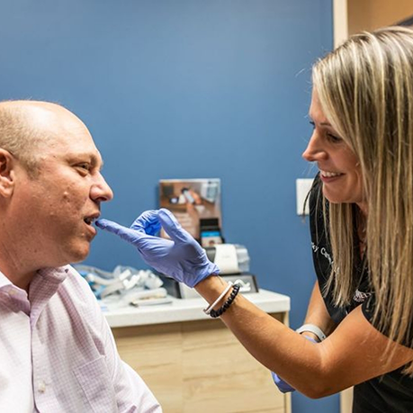 Sleep team member pointing to a patients mouth