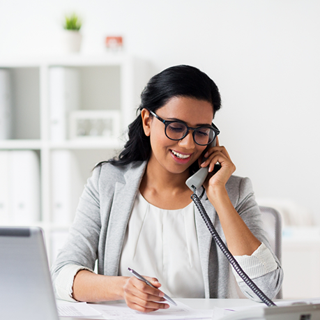 Woman smiling while talking on phone